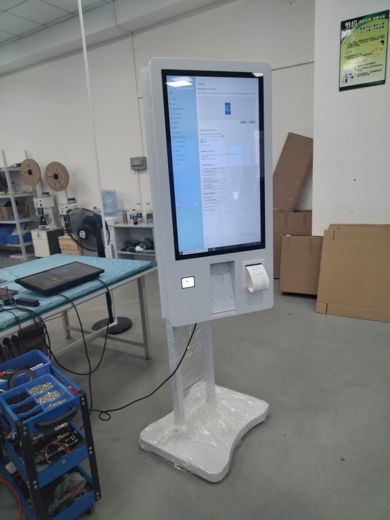 Customer reviewing an order on a large kiosk screen